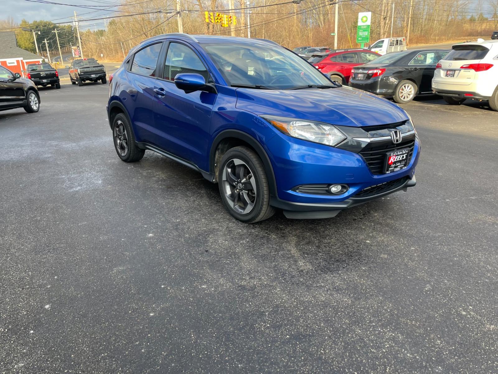 2018 Blue /Black Honda HR-V EX-L w/Navigation 4WD CVT (3CZRU6H71JM) with an 1.8L I4 DOHC 16V engine, Automatic transmission, located at 11115 Chardon Rd. , Chardon, OH, 44024, (440) 214-9705, 41.580246, -81.241943 - This 2018 Honda HR-V equipped with AWD (All Wheel Drive) and a 1.8L engine paired with a CVT (Continuously Variable Transmission) offers a blend of performance and efficiency. Its luxurious leather interior, complemented by heated seats and an automatic climate control system, ensures a comfortable - Photo #2